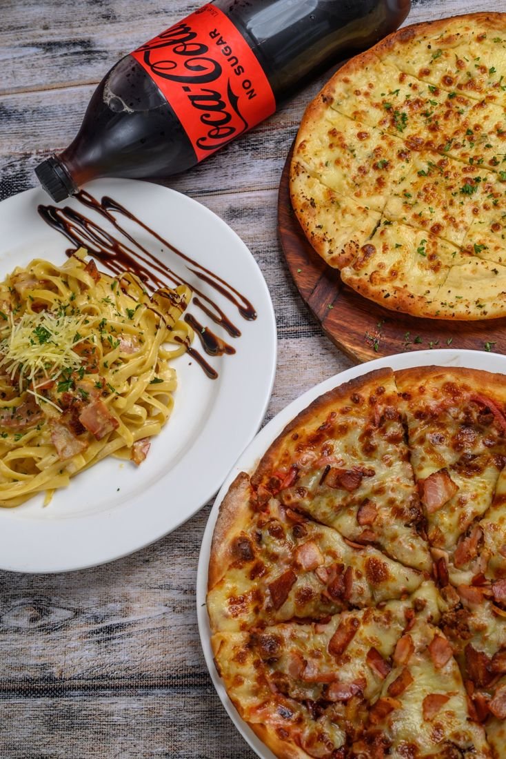 Carbonara pasta, garlic bread and Meat Gourmet pizza